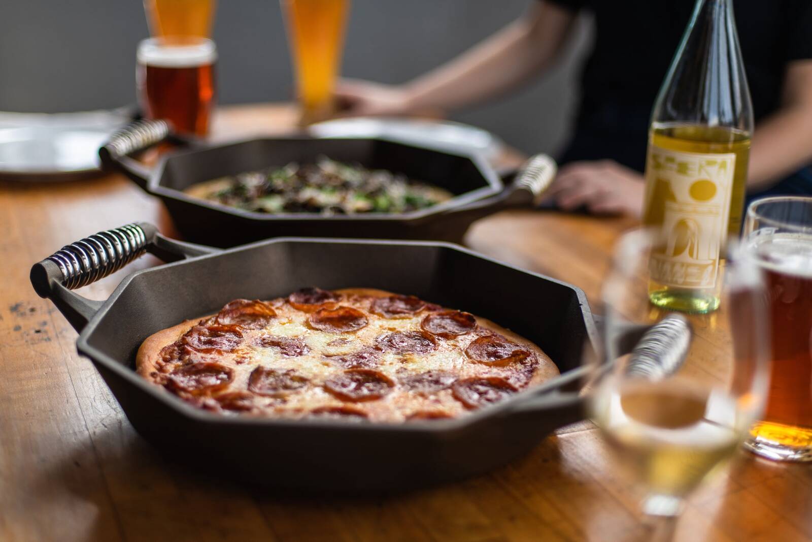 Pizza being cooked in Finex skillet
