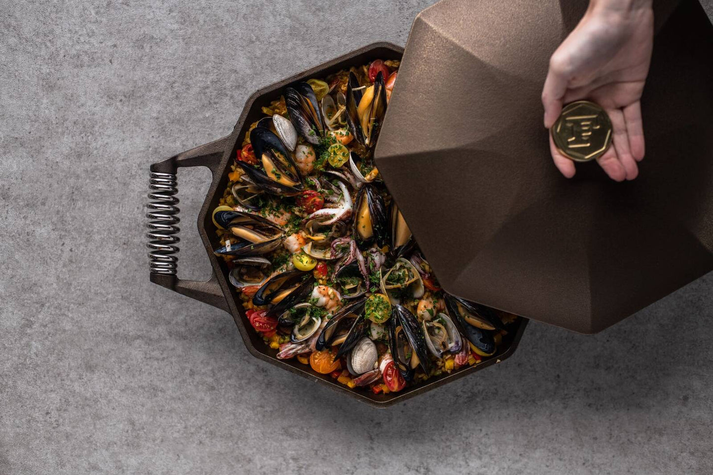 Seafood being cooked in Finex skillet