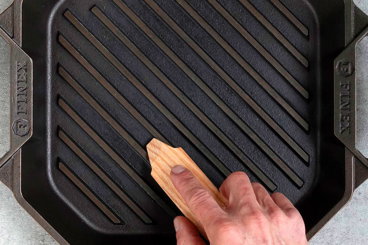 Close up of wooden grill pan scraper