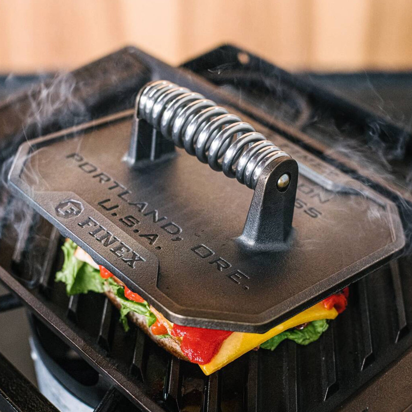 Grill press on sandwich