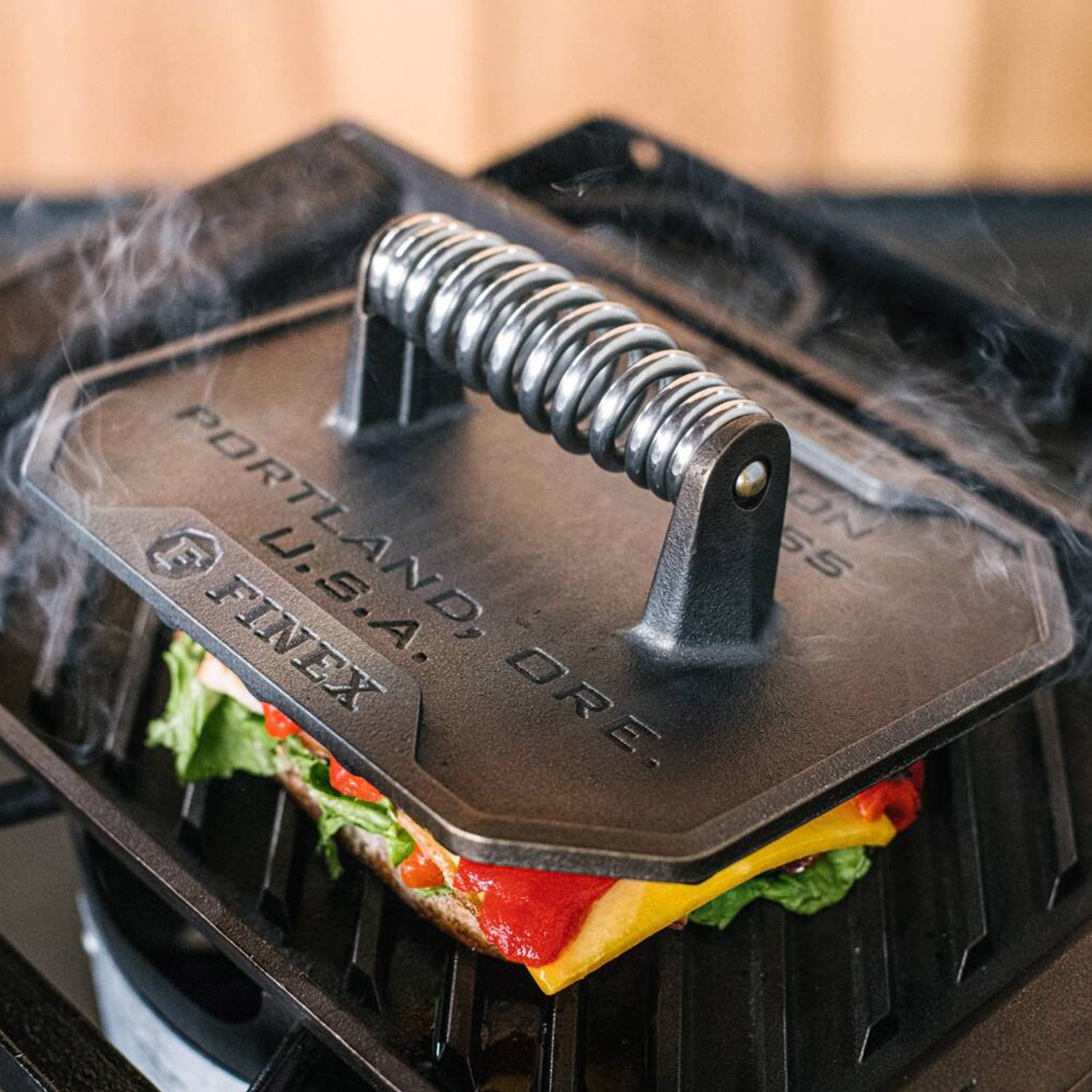 Grill press on sandwich