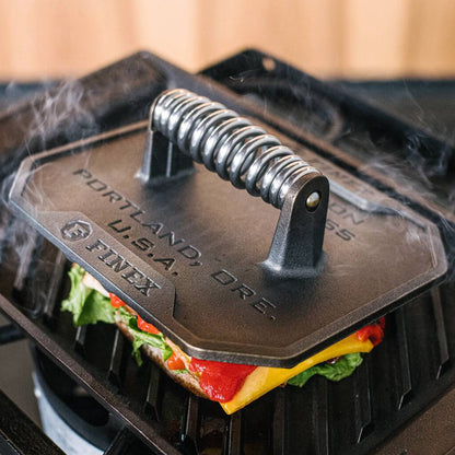 Grill press on sandwich